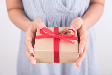 Woman hands holding gift box give for christmas or new year 
