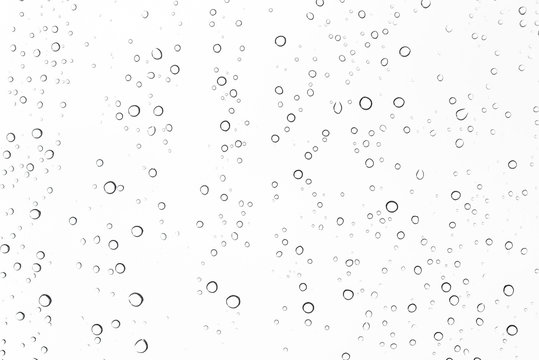 closeup water drops on car glass in rainy season.