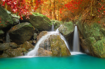Waterfall in autumn forest.