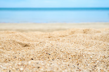 Naklejka premium Close up beach sand with blur sea at background