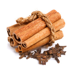 cinnamon sticks and cloves isolated on white background