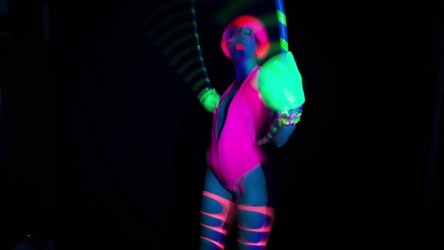 disco dancer in UV costume hulahoop glow