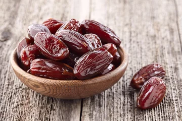  Dates fruit on a wooden background © Dionisvera
