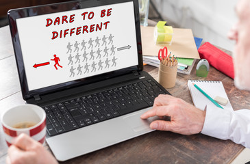 Dare to be different concept on a laptop screen