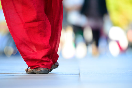 Close Up Of Person Walking On Street