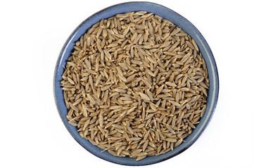 cumin seeds in blue dish