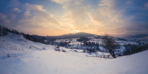 Panorama of winter mountains sunrise