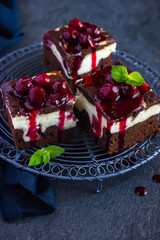 cheesecake brownies  with cherry sauce, selective focus