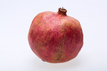 red pomegranate isolated on a white background