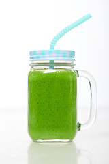 Jar tumbler mug with green smoothie drink