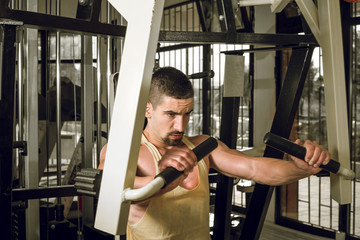 Young man doing chest workout