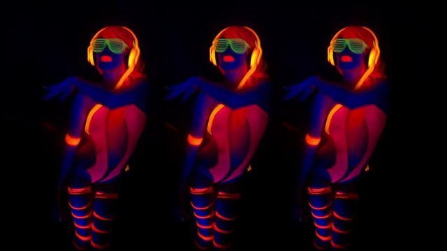 disco gogo dancer in UV costume glow