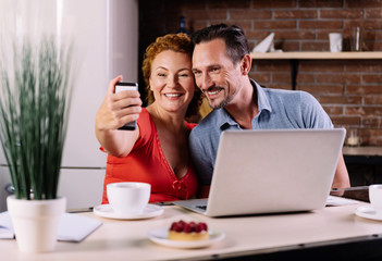 Man and woman taking selfie