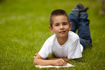 little happy boy reading book