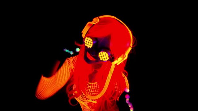 disco gogo dancer in UV costume glow
