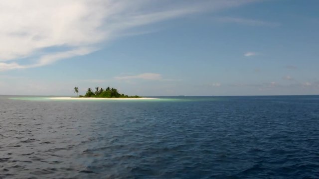 passes on a small island ari atoll boat view scuba diving maldives