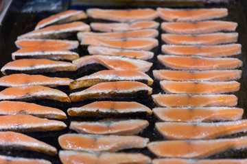 Grilled salmon steaks on the flaming
