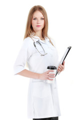 Portrait of young woman doctor with white coat standing in hospital