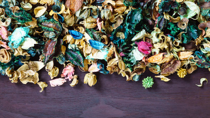 aromatherapy potpourri mix of dried aromatic flowers on wooden b