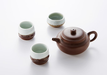 Three Chinese teapots on white background