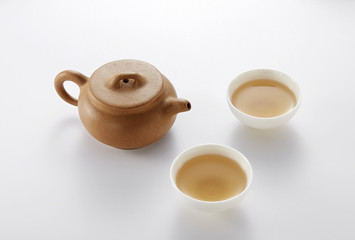 Chinese teapot and cups on white background
