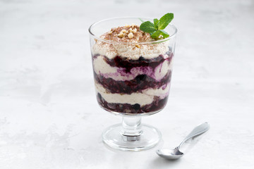 layered dessert with blueberries and cream