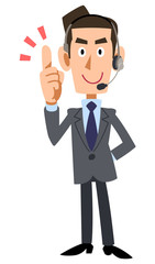 ヘッドセットをつけたビジネスマンが人差し指を立てる
