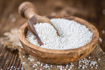 Tapioca on wooden background (selective focus)