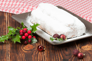 Stollen. Traditional Christmas Marzipan Pie. Decorations. Wooden