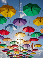 Fototapeta na wymiar Installation from multicolored umbrellas in the park of the city of Astana, Kazakhstan