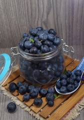 Freshly picked blueberries in jar . Juicy and fresh blueberries - Blueberry antioxidant. - Concept for healthy eating and nutrition
