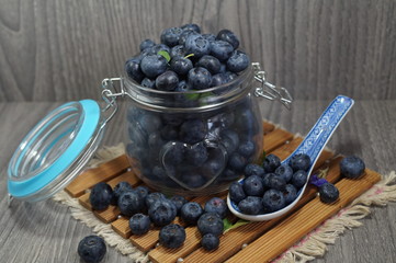 Freshly picked blueberries in jar . Juicy and fresh blueberries - Blueberry antioxidant. - Concept for healthy eating and nutrition
