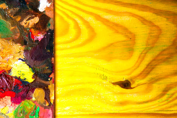 Fototapeta premium Painting palette on colored wooden background