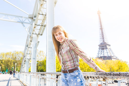 Portrait of a girl with Eiffel Tower on background in Paris