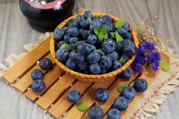 Freshly picked blueberries in a wicker basket 
 . Juicy and fresh blueberries - Blueberry antioxidant. - Concept for healthy eating and nutrition
