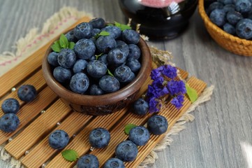 Freshly picked blueberries in a wooden bowl, . Juicy and fresh blueberries - Blueberry antioxidant. - Concept for healthy eating and nutrition
