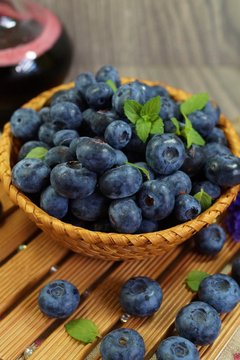 Freshly picked blueberries in a wicker basket 
 . Juicy and fresh blueberries - Blueberry antioxidant. - Concept for healthy eating and nutrition
