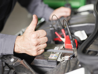 Mechanic shows thumb up