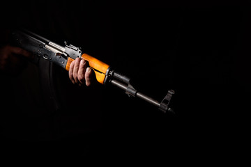 Kalashnikov assault rifle close-up in the dark
