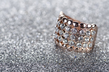 Jewellery ring against shiny background
