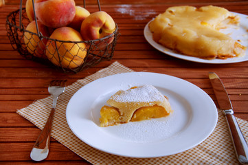 Peach caramel turnover pie sprinkled with sugar powder