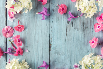 frame of flowers, background blue boards