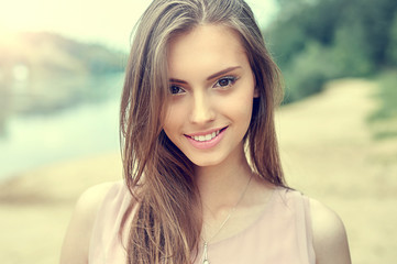 Obraz premium Portrait of beautiful young girl with clean skin and pretty face