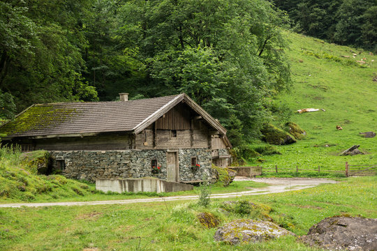 house made of stone in mountains of Alps
