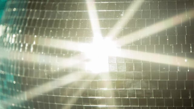 funky discoball spinning with light effects rays