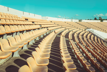 Empty seats at soccer stadium , vintage