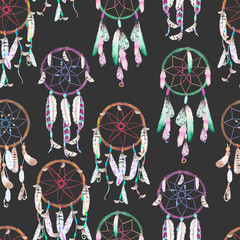 Seamless pattern with dreamcatchers, hand drawn in watercolor on a dark background