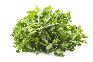 Obraz premium handful of fresh arugula leaves on the white background