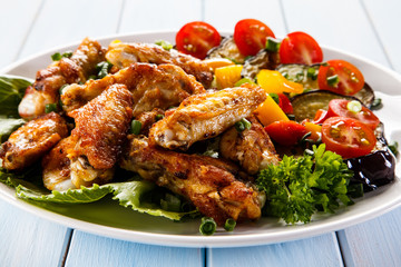 Grilled chicken wings and vegetables