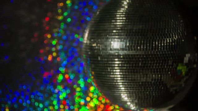 funky discoball spinning with light effects rays